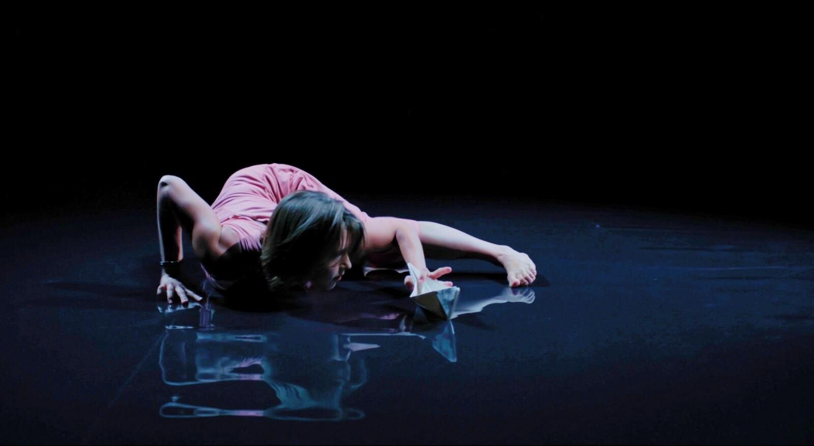 Ivonne Kalter in movement on a reflective floor
