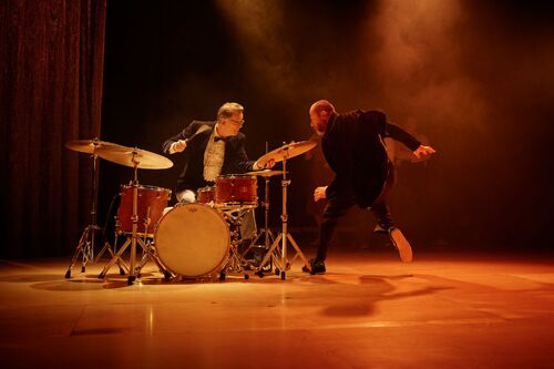 Conor Guilfoyle at the drums and Jonathan Mitchell in movement facing him on stage