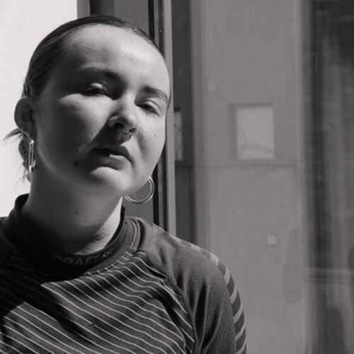 Black and white headshot of Alex Vostokova