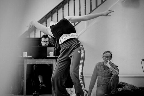 Rosie Stebbing in movement with David Bolger watching in the background