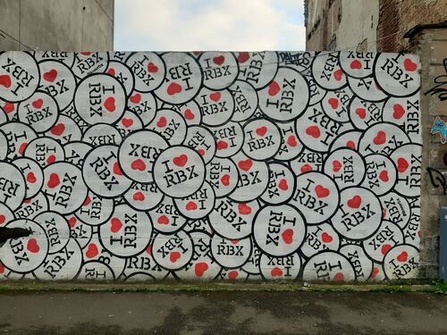 A mural of badges that read 'I heart RBX'