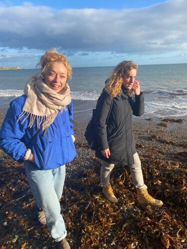 Justine Cooper and Vittoria Caneva walking beside the sea