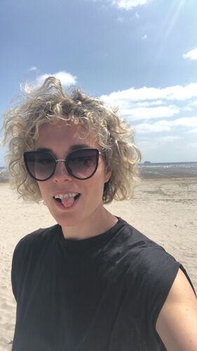 A selfie of Marion Carriau on a beach