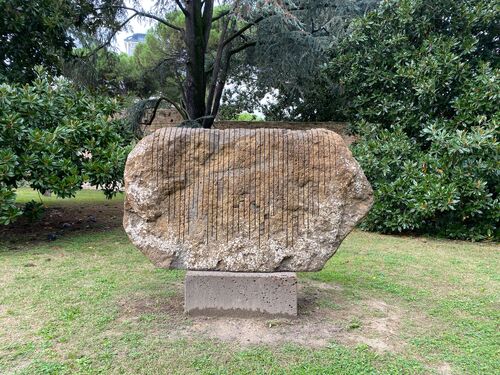 A large piece of stone with lines etched on the surface