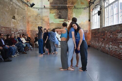 Participants standing in clusters of movement in the CoisCéim studio