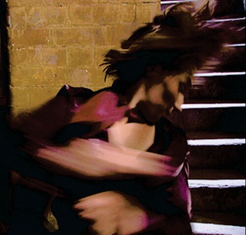 A blurred figure in motion in a stairwell