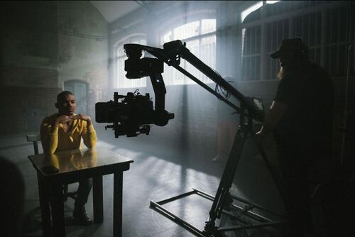 José Guillermo Dirocie being filmed seated at a desk