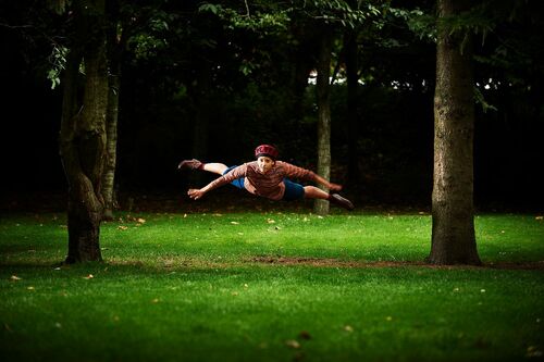 Ivonne Kalter airborne in a wooded setting outdoors