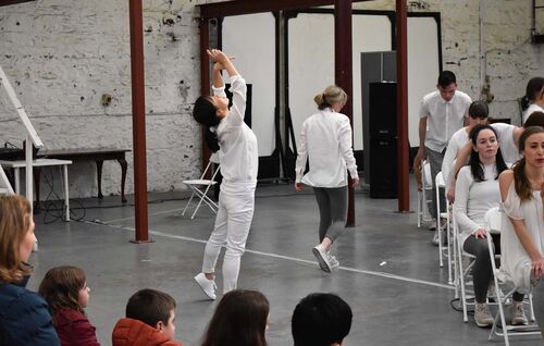 Participants dancing in an industrial space