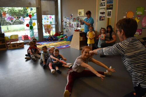 Philippa Donnellan and Olwyn Lyons leading a group of children in dance