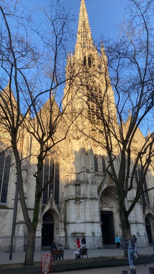 A cathedral with blue sky behind it