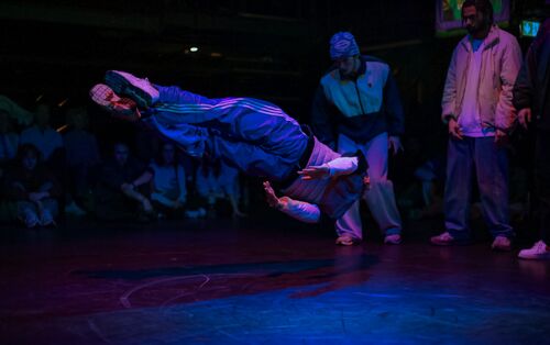 A dancer airborne in movement