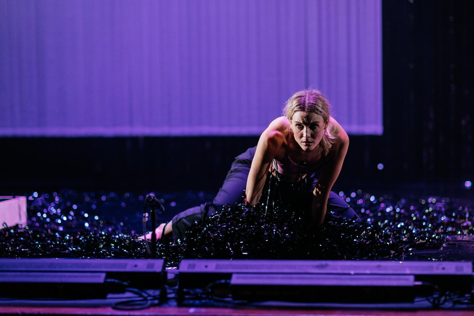 Dancer in motion with a video film prop