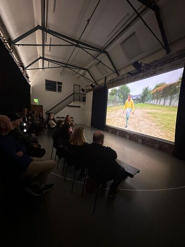 People are watching a screening of the show