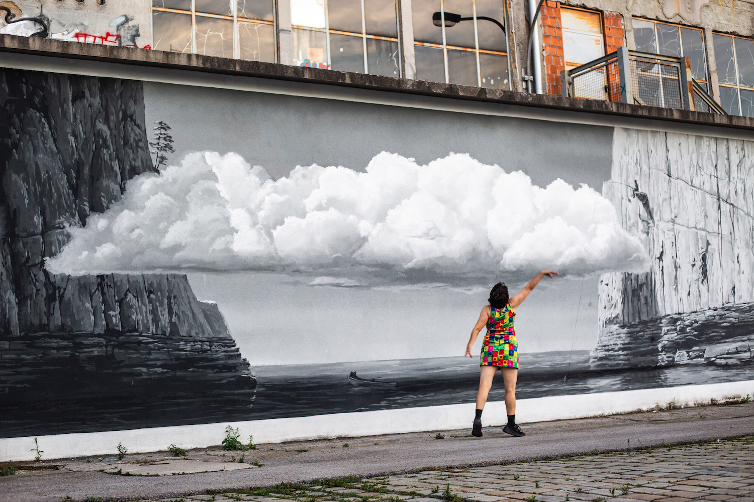 A dancer holding a cloud in her hand in a wall painting